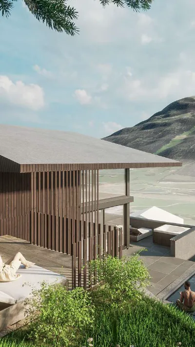 Sandro Anibas sitzt in einer luxuriösen Wohnung und schaut lächelnt von einer Zeitschrift auf