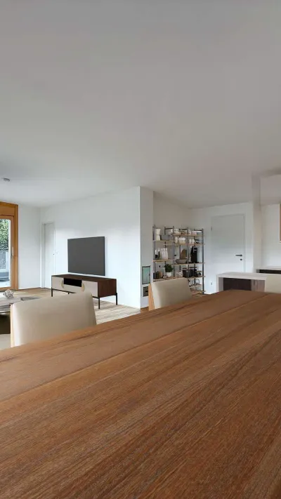 Sandro Anibas sitzt in einer luxuriösen Wohnung und schaut lächelnt von einer Zeitschrift auf