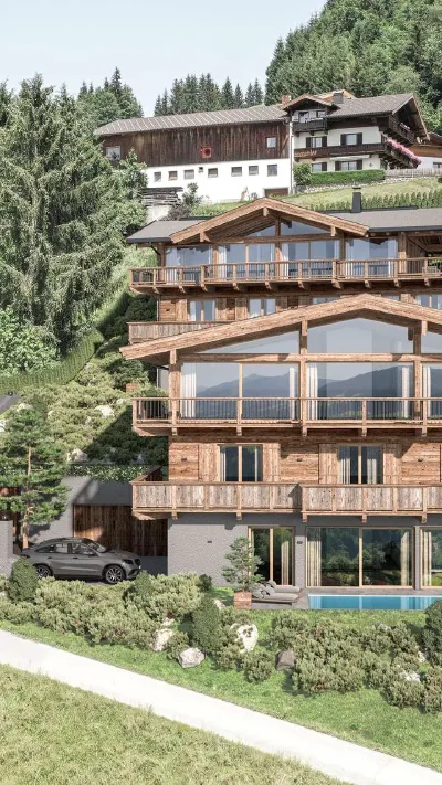 Sandro Anibas sitzt in einer luxuriösen Wohnung und schaut lächelnt von einer Zeitschrift auf